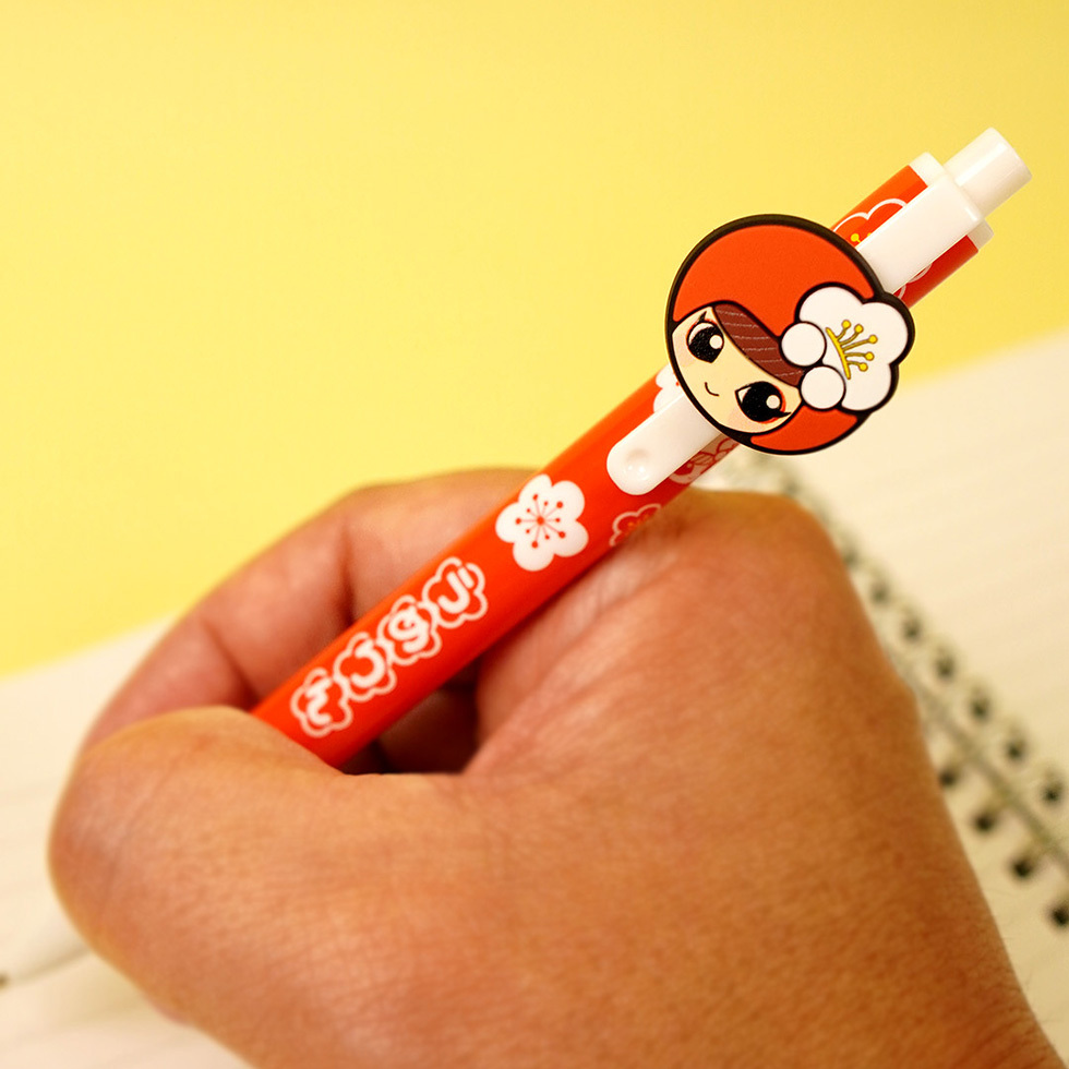 うめりん ボールペンを握る図